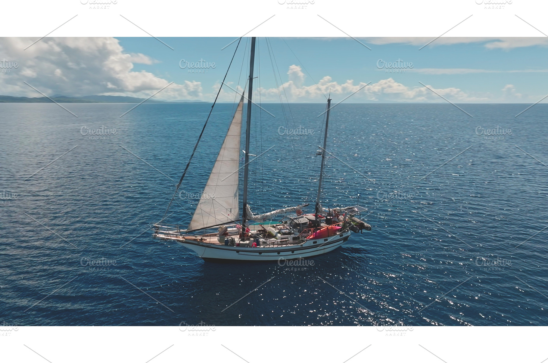 Ketch sailing in the ocean near a, a Transportation Photo by Goinyk