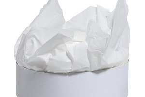 Round white box with wrapping paper inside on isolated backgroun, a Food & Drink Photo by ndanko