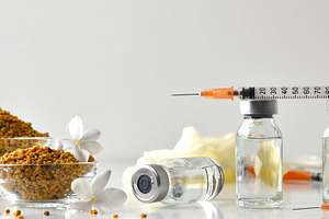 Pollen vaccination background with vials syringe and bowl with a, a Health & Medical Photo by Davizro's Market