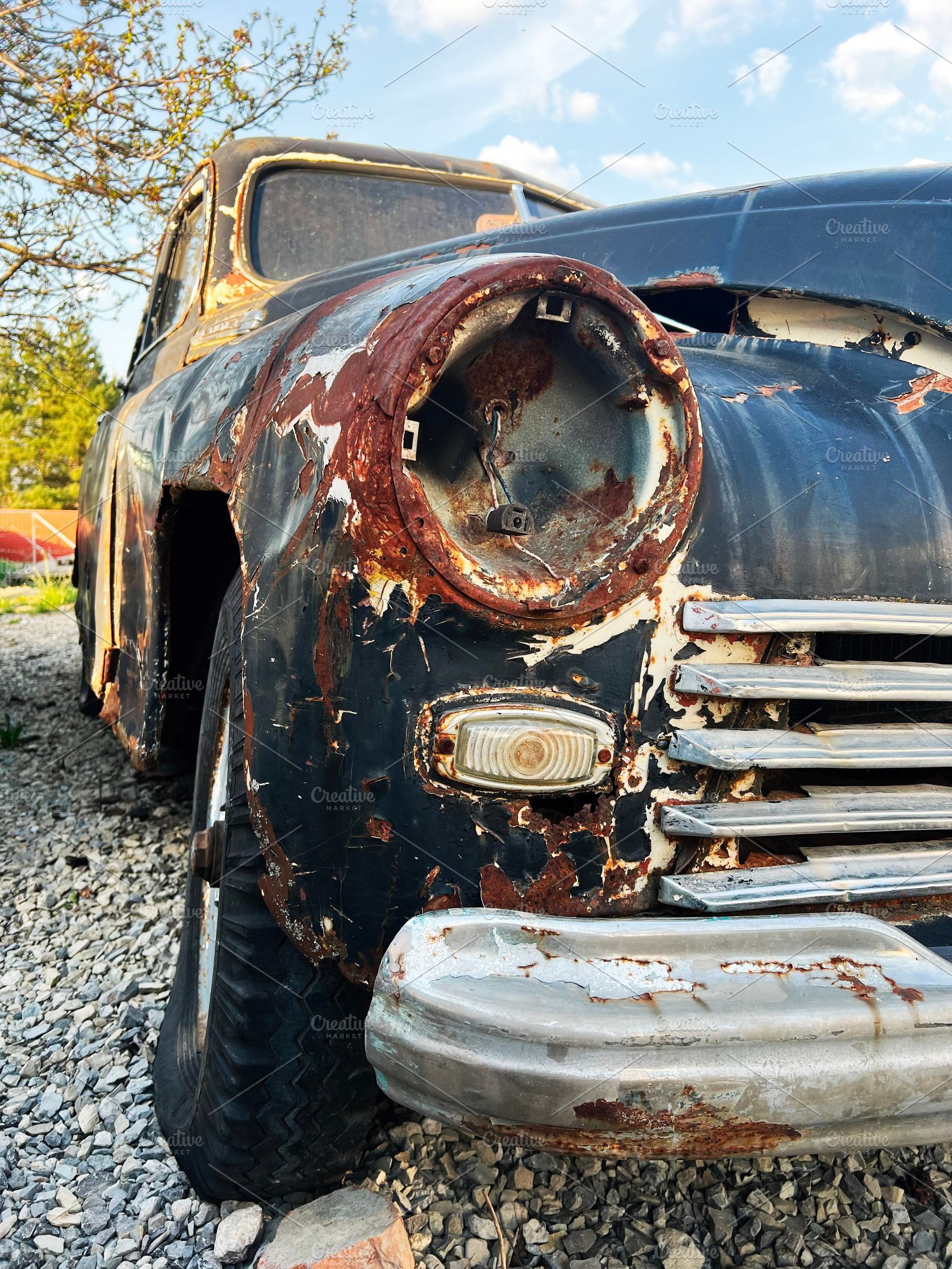 Rusty Vintage Car with Weathered Exterior in Natural Outdoor Setting, a Photo by AS photostudio