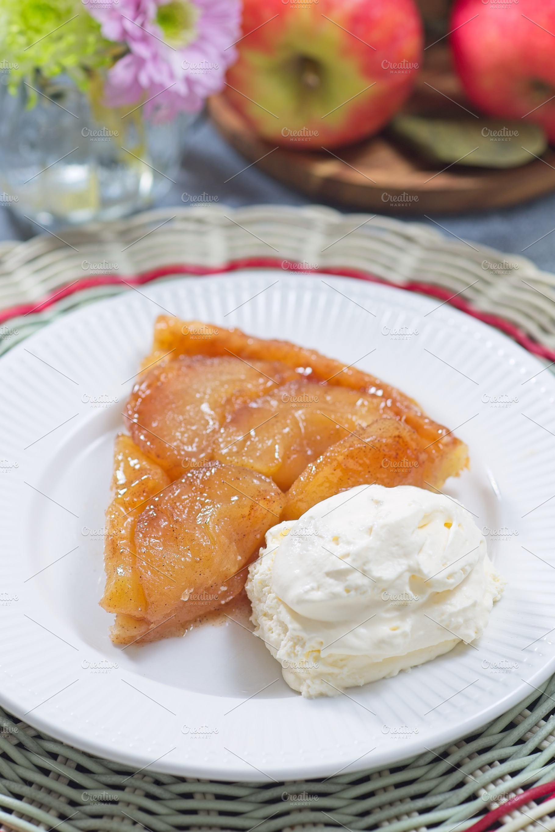 Slice of caramelized apple Tart Tartin with whipped cream, french upside down c, a Food & Drink Photo by iuliia_n