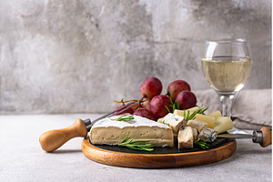 Different types of cheese, wine and, a Food & Drink Photo by Yulia Furman