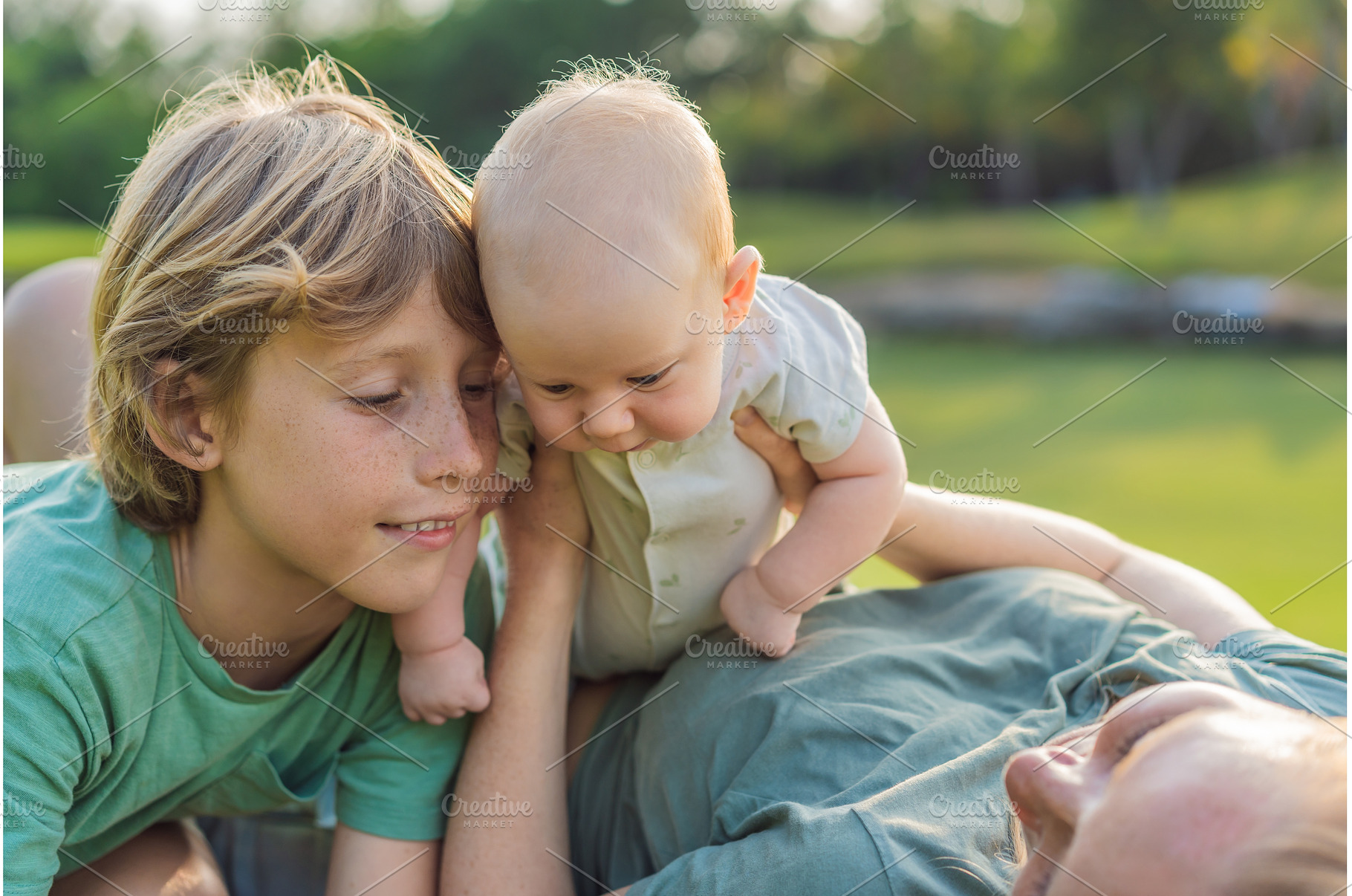 Mother, older son, and newborn baby, a Person Photo by Elizaveta Galitskaya