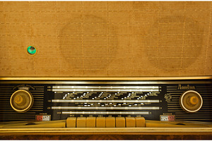 Vintage radio-gramophone working, a Technology Photo by Leonid Andronov