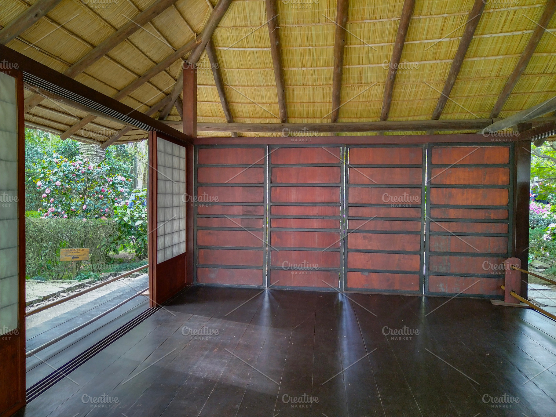 Japanese-style pavilion with open wooden floor, botanic garden,, a Nature Photo by DanFLCreativo