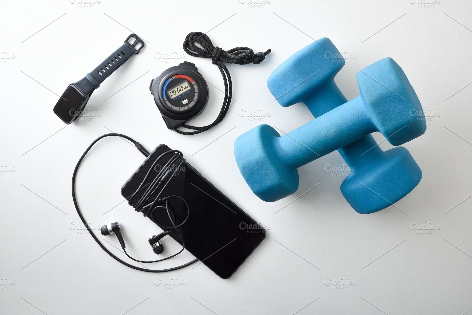 Sports equipment with dumbbells and electronic devices, a Sports & Recreation Photo by Davizro's Market