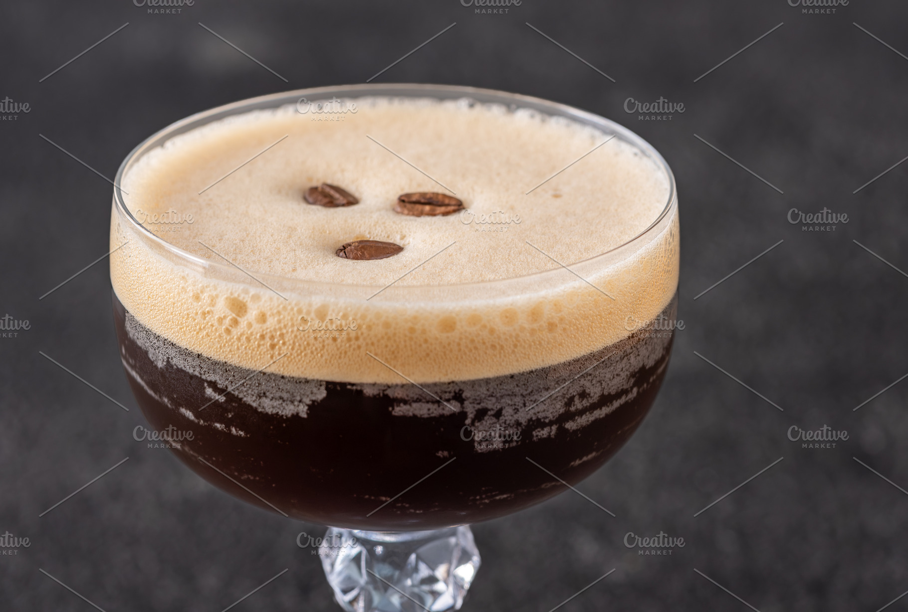 Classic Espresso Martini with thick crema foam and coffee bean g, a Food & Drink Photo by Alexander Prokopenko
