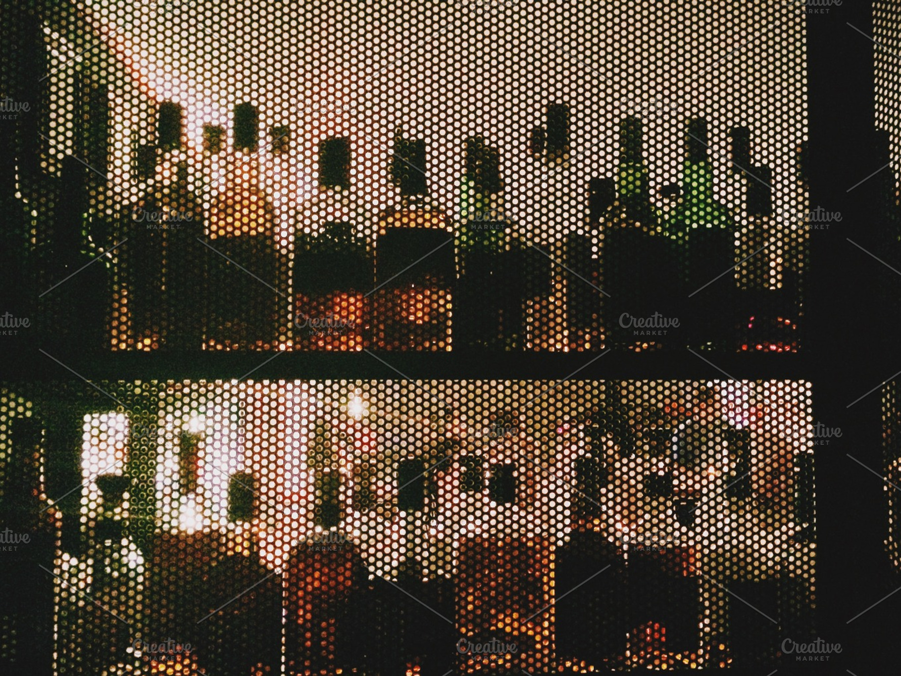 Alcohol Bottles In A Bar From Behind