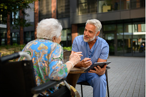 Healthcare professional explaining, a Health & Medical Photo by HalfPoint