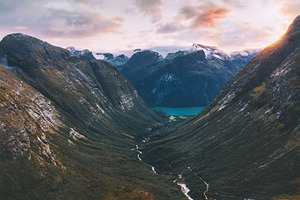 Aerial view mountains valley and lov containing norway, lake, and landscape