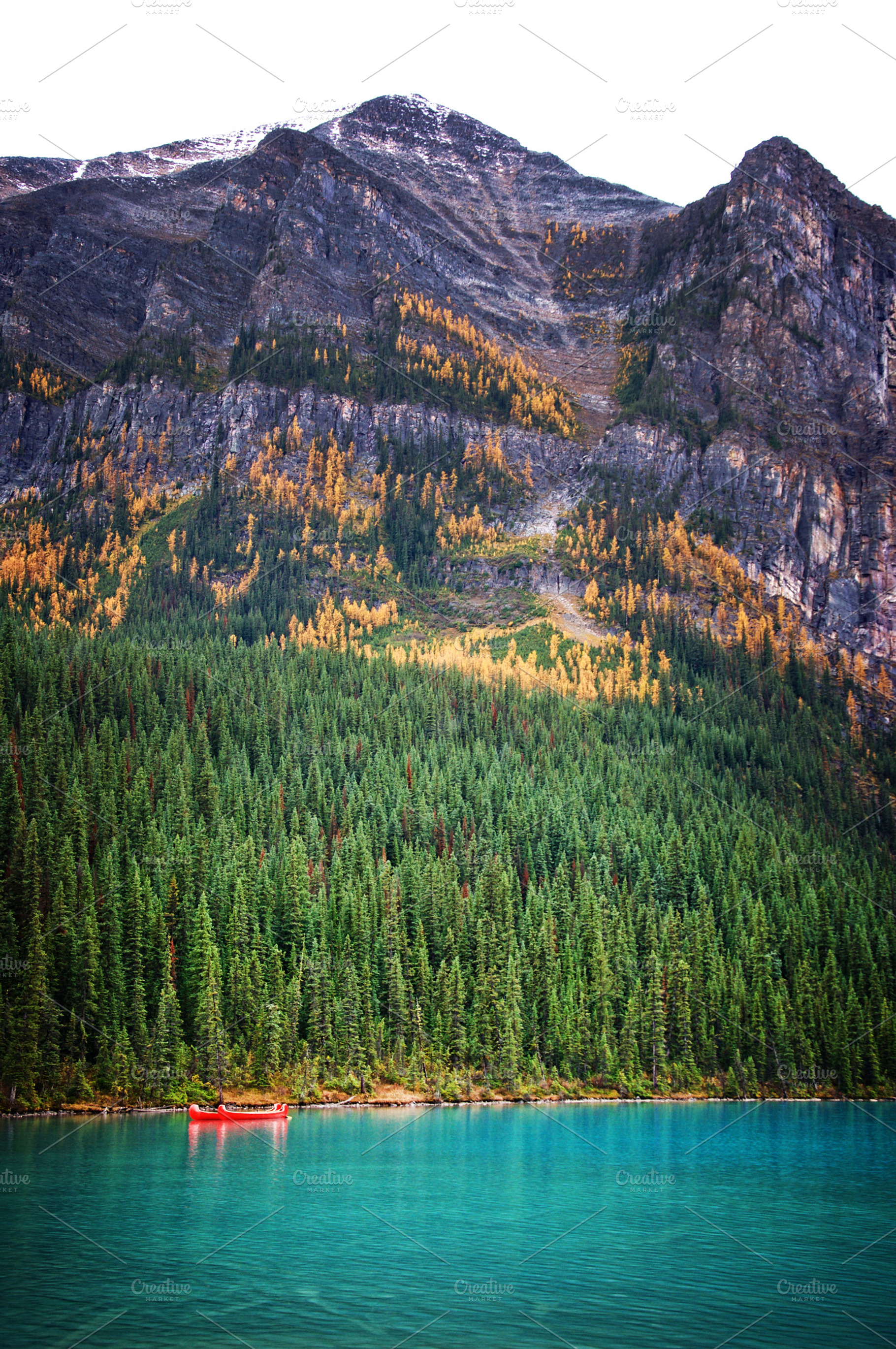 Lake Louise Canoes in the Fall, a Nature Photo by Crux Creative