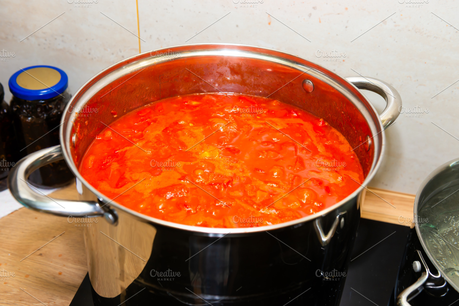 Tomato sauce in big cooking pot, a Food & Drink Photo by Vapi