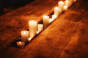 Glowing Candles in Rustic Wood Table, an Architecture Photo by SkyNext