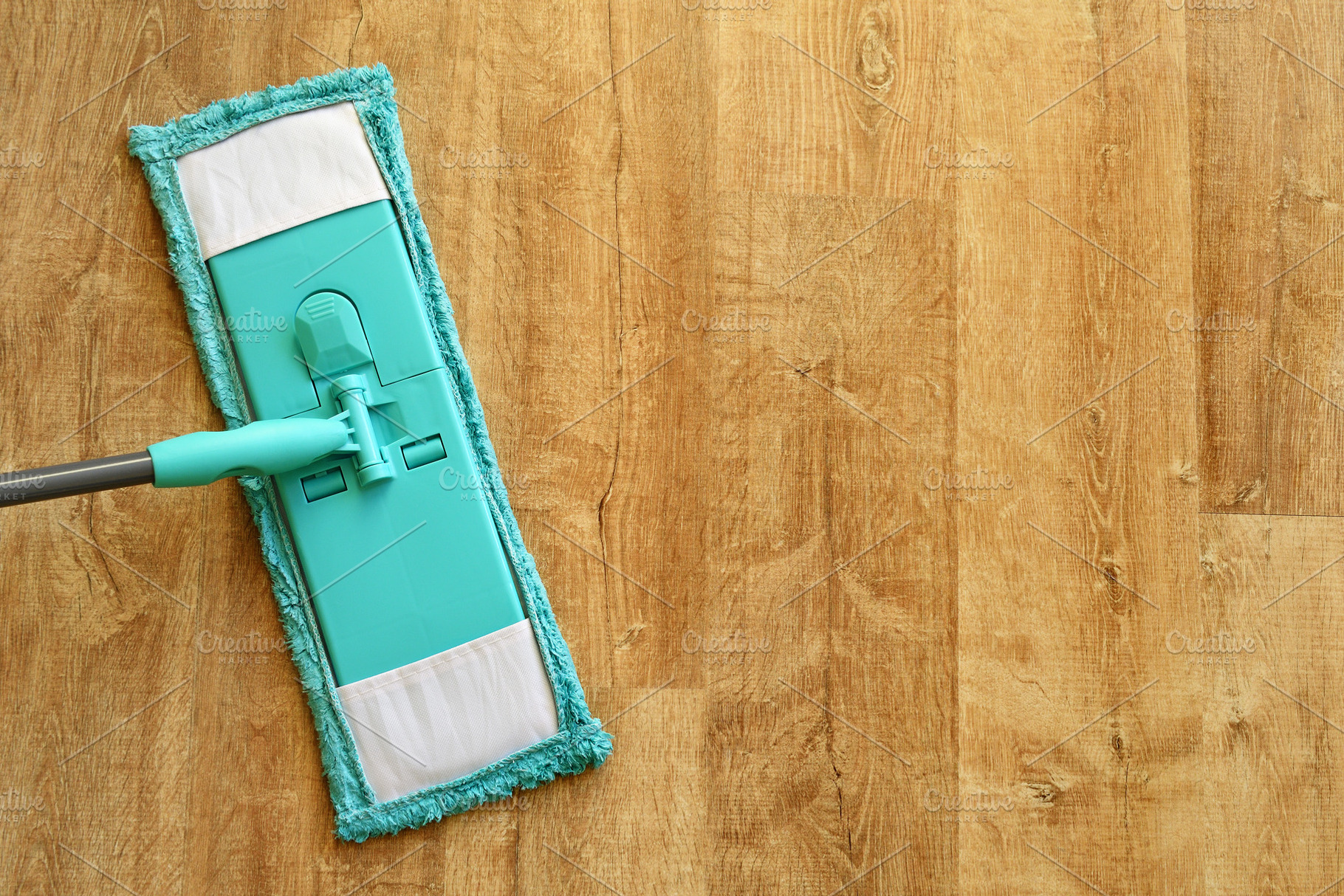 Mop on laminate flooring top view, an Abstract Photo by Anatoliy Sadovskiy