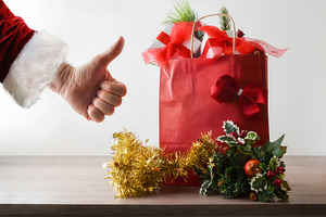 Christmas shopping with red bag and hand with ok gesture, a Holiday Photo by Davizro's Market