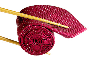 Chopsticks holding red mens necktie, a Beauty & Fashion Photo by BOOCYS
