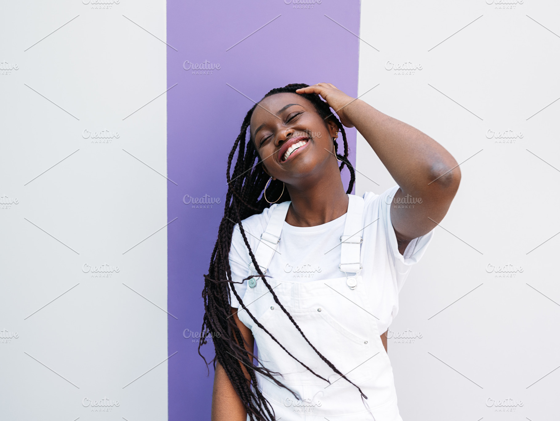 Young woman with braids having fun, a Person Photo by Artem Varnitsin