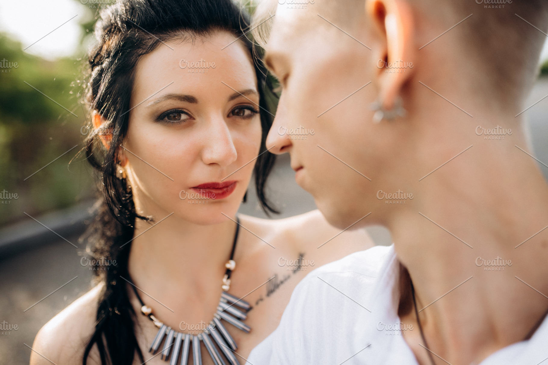 A couple of newlywed freaks on a black custom bike, a Person Photo by Weddings, People, Travel