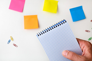 Hand Holding Blank Grid Notebook with Sticky Notes, a Business Photo by Davizro's Market