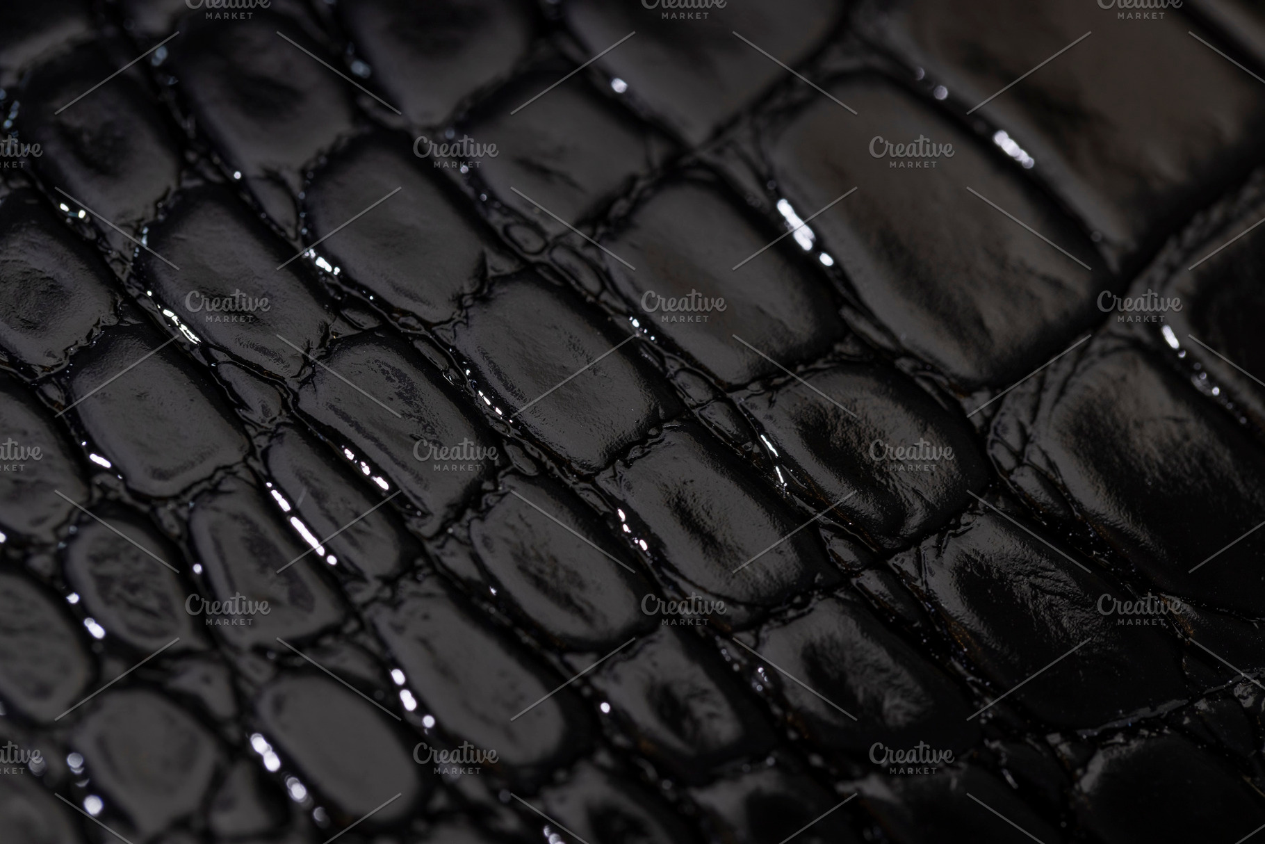 black polished leather dyed black with embossed crocodile leather, a Photo by rsoollAI