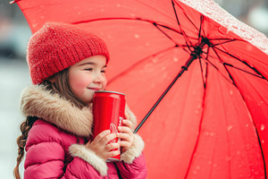 Cute little girl enjoys a drink unde, a Photo by Iftikhar Alam