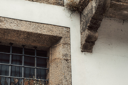 Stone facade with window and balcony, an Architecture Photo by SkyNext