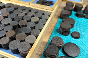 A collection of old Russian Empire coins arranged in wooden trays, some stacked, an Industrial Photo by Textures & Backgrounds