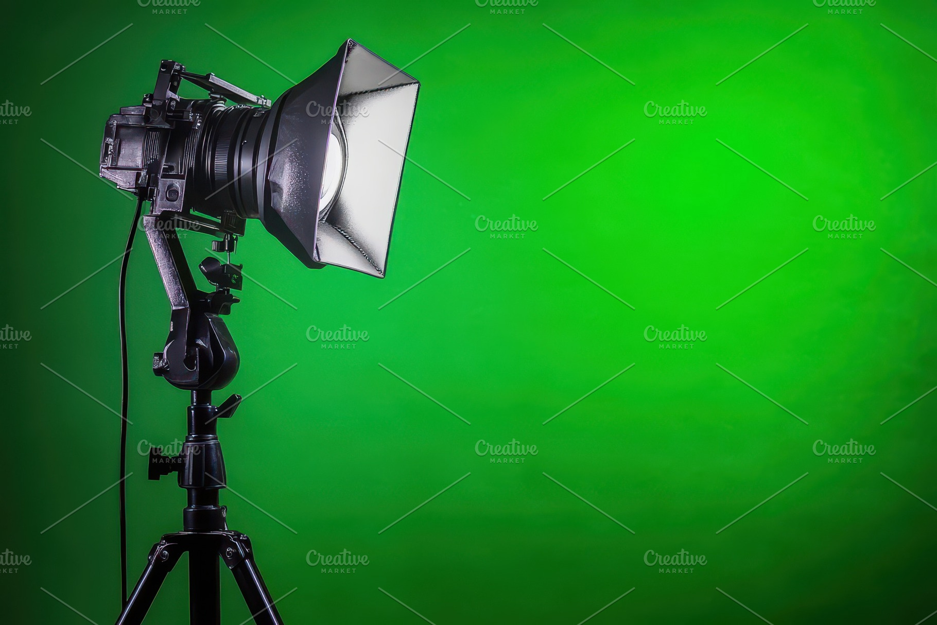 Spotlight on a tripod set against a, a Photo by Iftikhar Alam