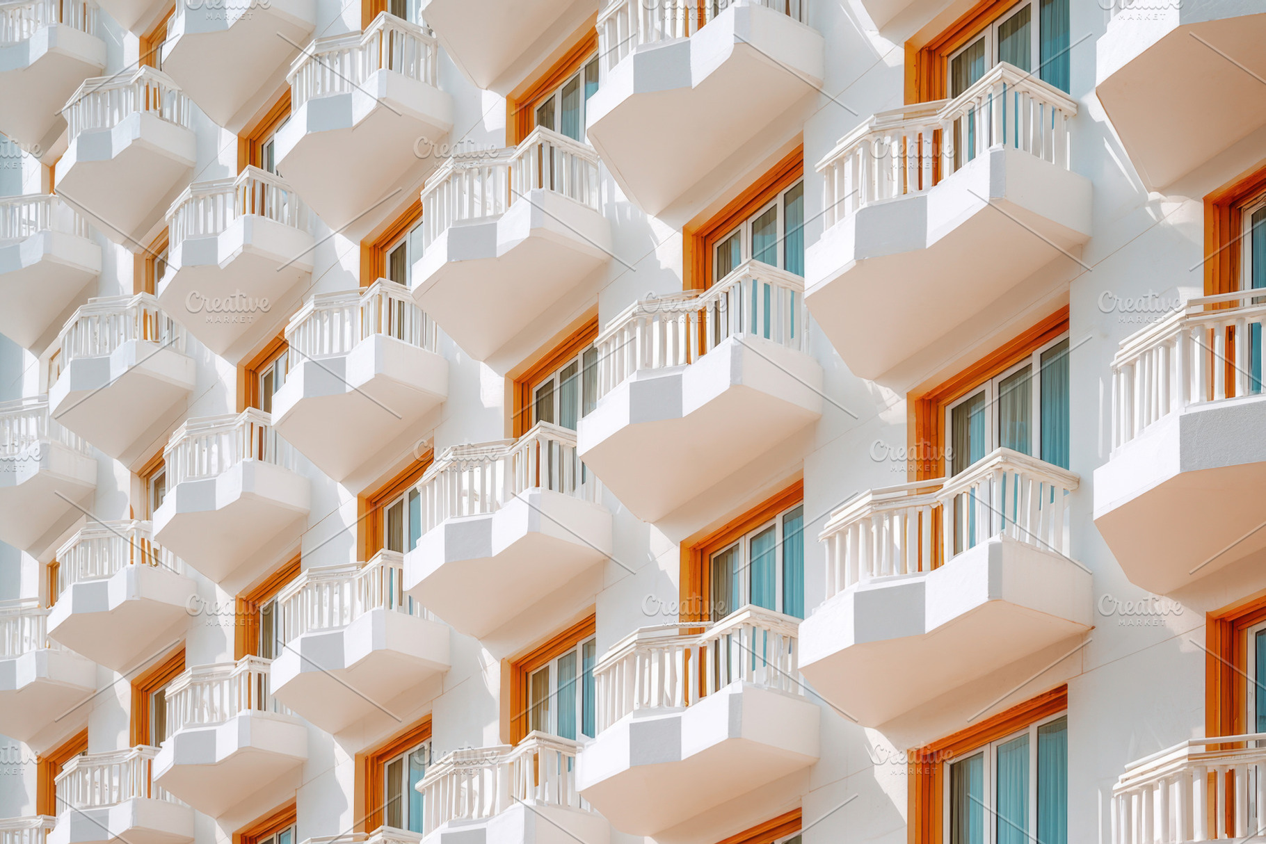 Modern white building with balconies, an Architecture Photo by AlyaAnd