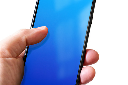 Hand holding a smartphone with blank blue screen. Isolated on wh, a Technology Photo by GoodGoods