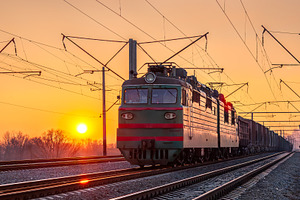Freight electric locomotive at sunset in Kyiv, Ukraine, a Transportation Photo by Leonid Andronov
