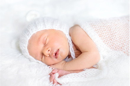 Newborn baby sleeps in a hat, a Beauty & Fashion Photo by yanadjana