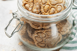 Homemade dog treats paw print cookies in jar, a Food & Drink Photo by Olena Rudo