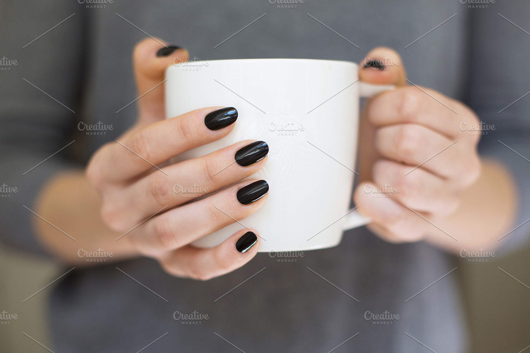 Hands holding coffee cup, a Photo by M. Klasan