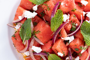 Fresh Watermelon Feta Salad with Mint and Red Onion on wooden ta, a Food & Drink Photo by etorres69