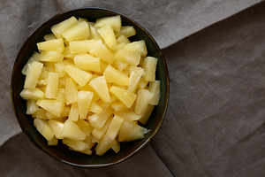 Canned Pineapple Tidbit Chunks in a Bowl, top view. Copy space., a Food & Drink Photo by LiudmylaChuhunova
