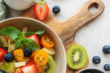 Healthy fresh fruit salad in a bowl, a Food & Drink Photo by Olena Rudo