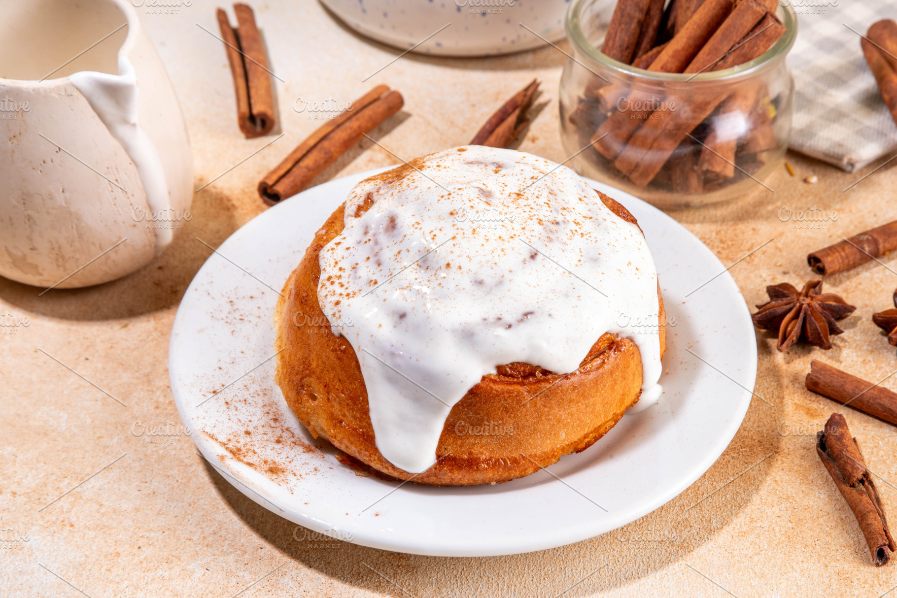 Freshly baked cinnamon roll bun, a Food & Drink Photo by Rimma