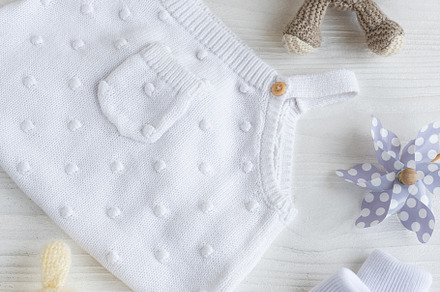 Set of white clothes and accessories for newborn baby. Knitted t, a Beauty & Fashion Photo by Olena Rudo