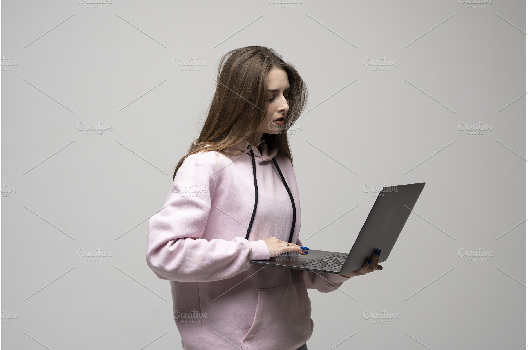Young brunette woman in hoodie, a Person Photo by volodymyrshtun13795