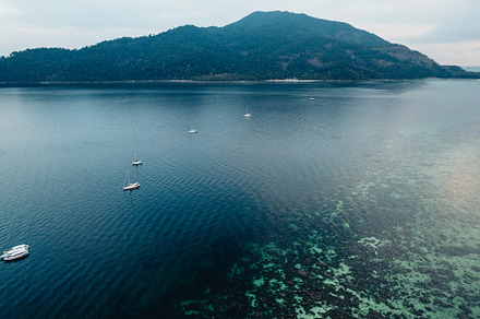 Sea and island at dusk from above, a Nature Photo by Art Rachen