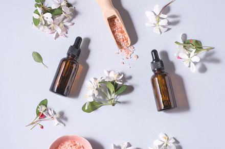 Face and body care flat lay, flowers