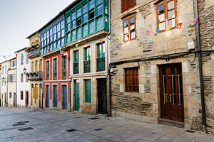 Colorful Historic Townhouses with Balconies and Bunting, Lugo, S, an Architecture Photo by Bepslabor