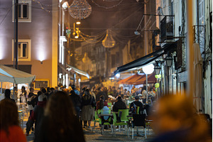 A crowd of people walking down a