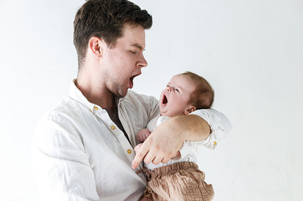 Stylish father holding and having fun with little baby son again