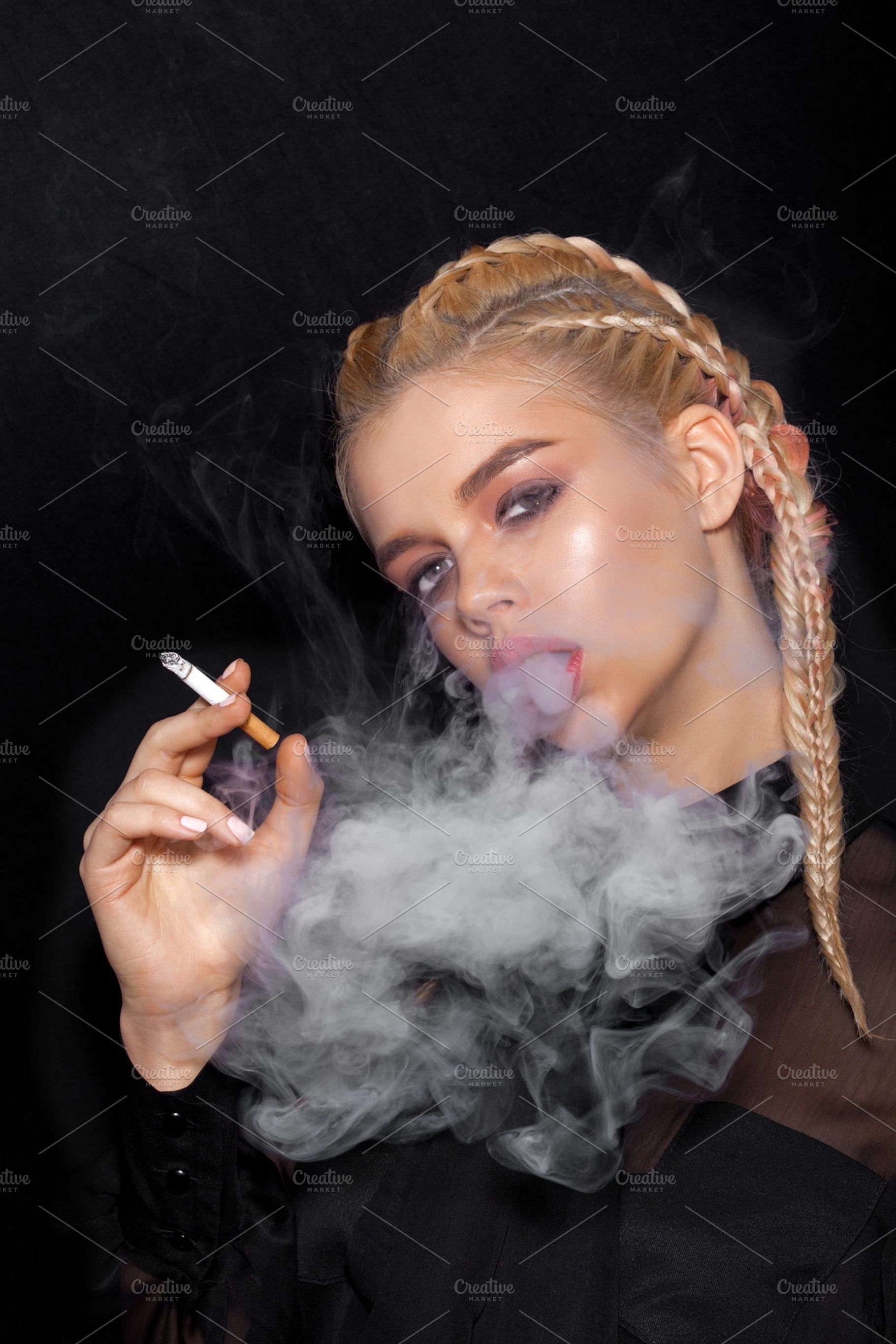 Beautiful woman smoking cigarette featuring girl, woman, and dress, a  Person Photo by Aliaksei Kaponia
