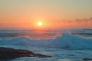 Vibrant sunset over the ocean with c, a Photo by Iftikhar Alam