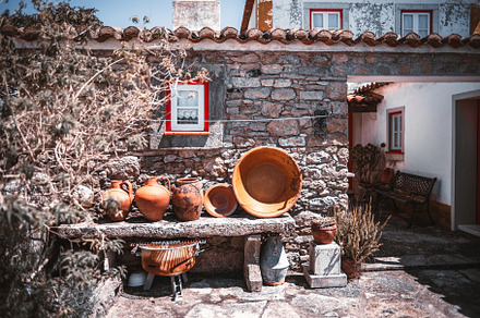 Rustic courtyard with terracotta pots, a Wallpaper Photo by SkyNext
