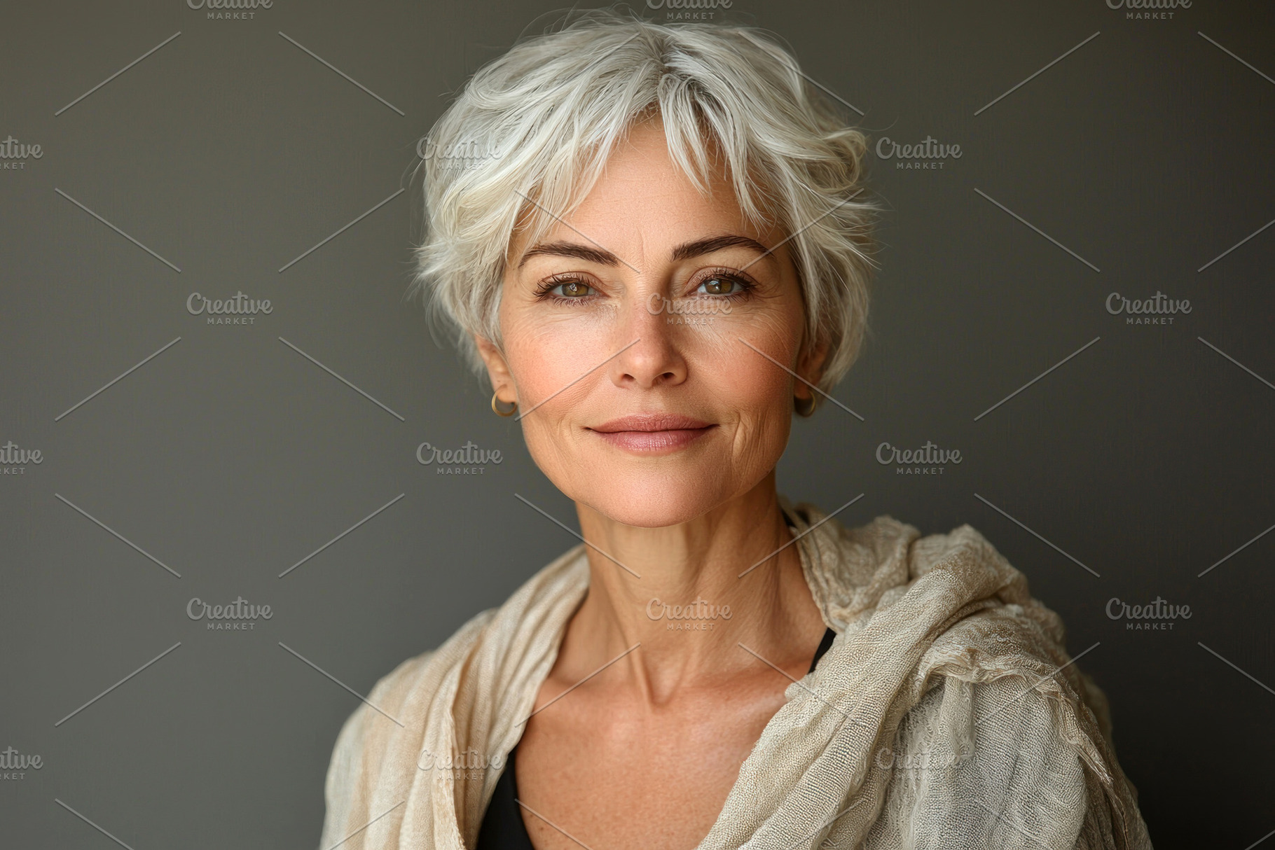 Elegant mature woman with short white hair wearing beige scarf s, a Person Photo by José Manuel Gelpi