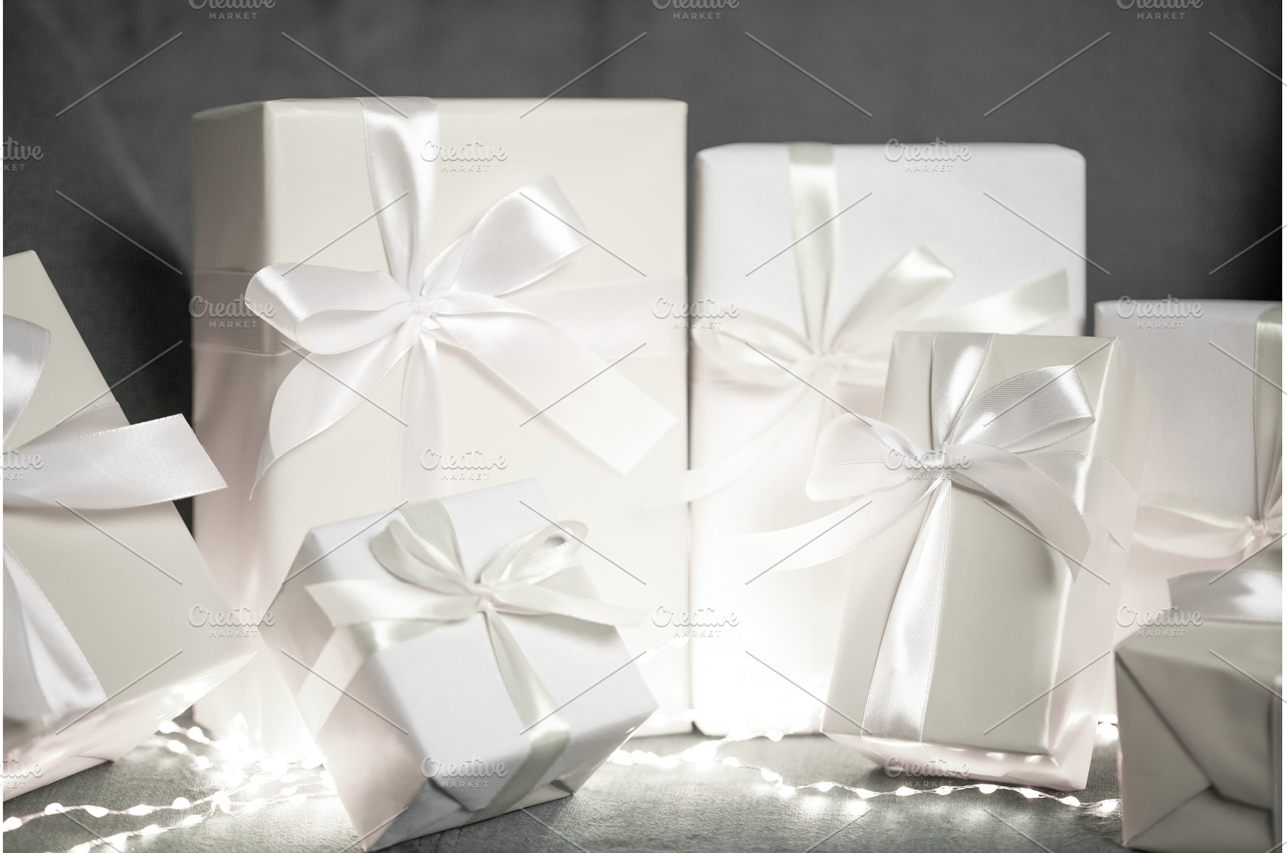 White gift boxes with silk ribbons, a Holiday Photo by Anna Efetova